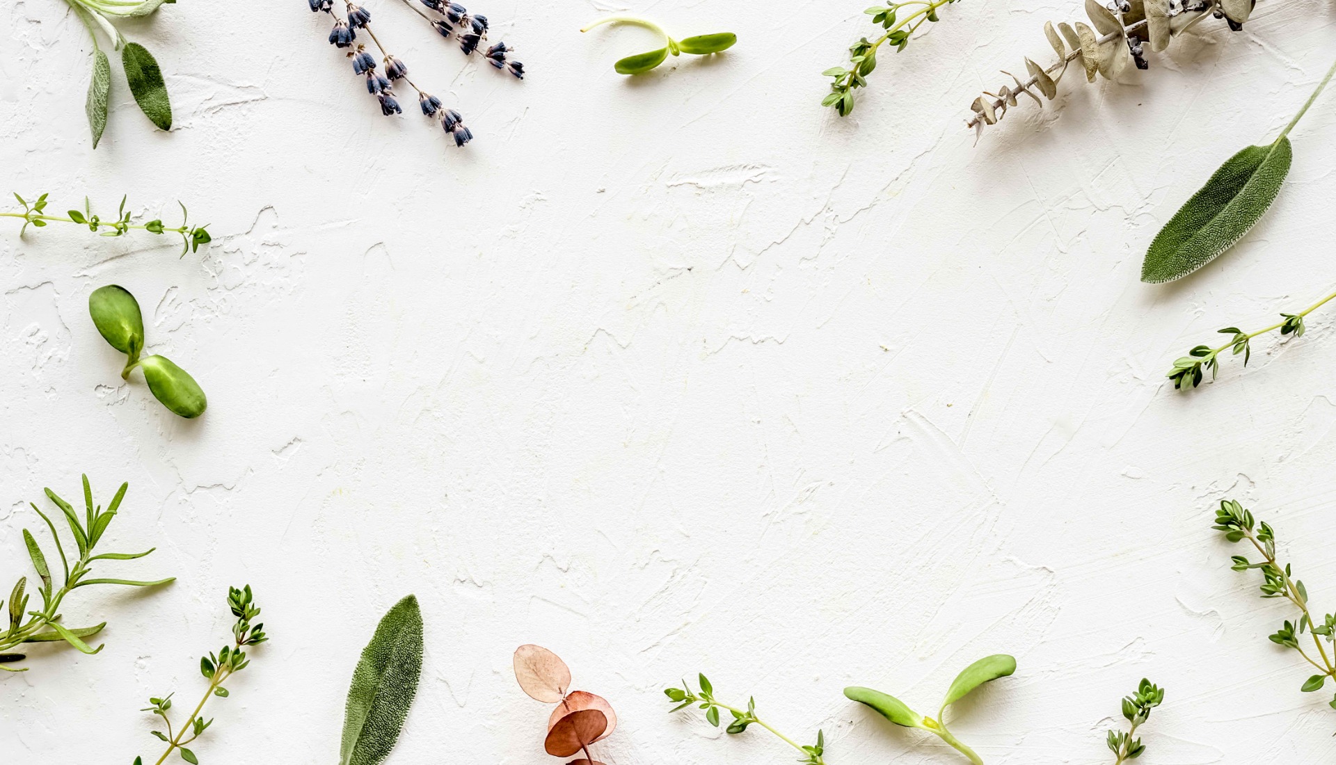 Man holding bike while standing on gray mountain